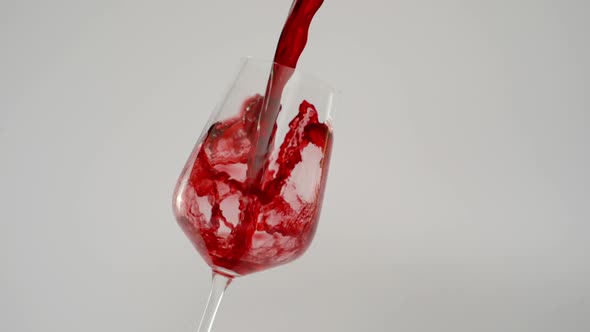 Super Slow Motion of Red Wine Splashing in Transparent Glass at 1000 Fps