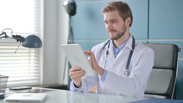 Doctor Working on Tablet in Clinic
