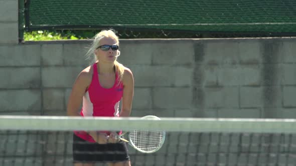 Women playing tennis.