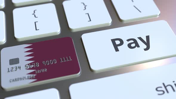 Bank Card with Flag of Qatar As a Key on a Keyboard alt