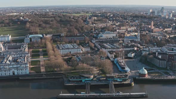 Cinematic circling drone shot of Greenwich pier cutty sark