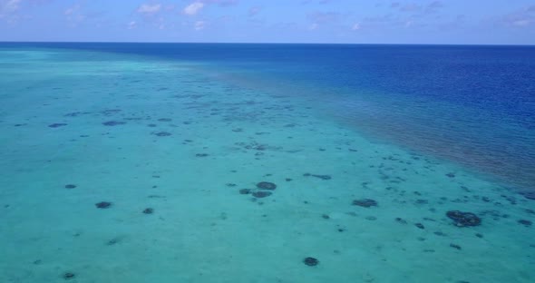 Wide overhead abstract shot of a paradise sunny white sand beach and turquoise sea background in col