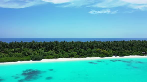 Wide angle aerial clean view of a summer white paradise sand beach and aqua turquoise water 