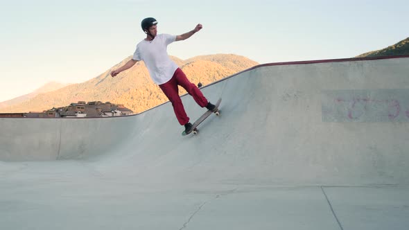 Skateboard Rider Sharpening His Skills in Bowl Ramp