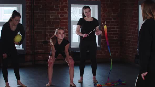 Young Women Gymnasts on Training in the Studio