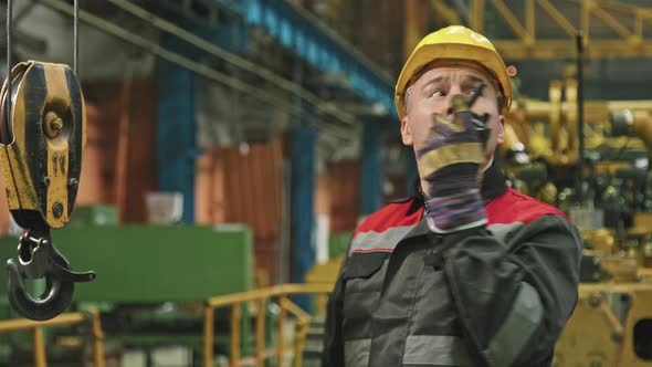 Plant Foreman Giving Instructions Via Walkie-Talkie