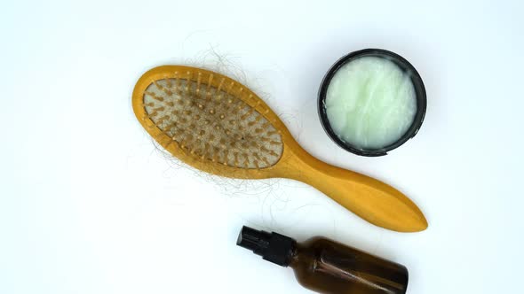 Vertical orientation video: Hairbrush with fallen out hair. Lots of fallen hair on a comb