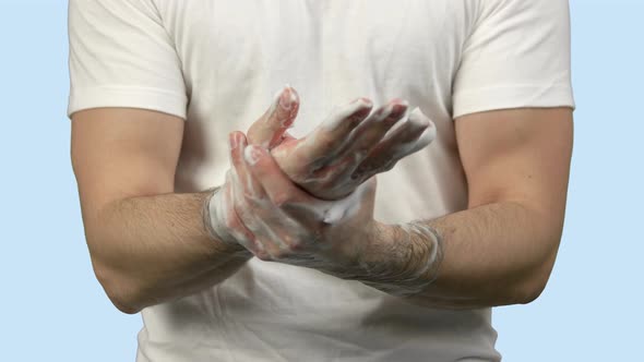 Man Washing His Hands with Soap Foam