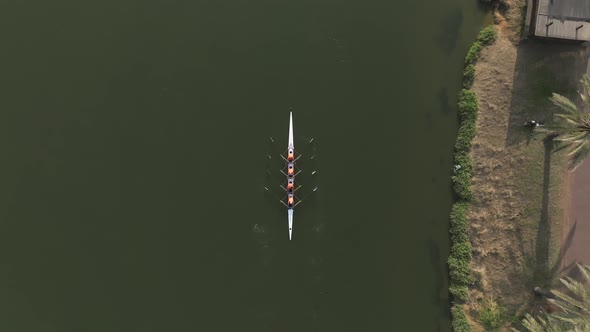 Sport canoe team rowing in a river, Drone footage.