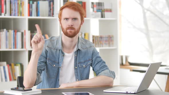 Casual Redhead Man Waving Finger to Reject at Work