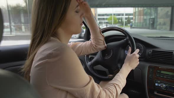 Upset Business Woman Sitting in Car and Thinking About Problems, Sadness