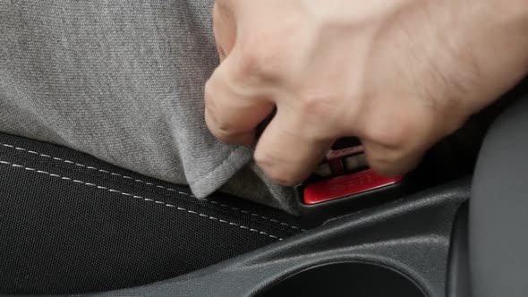 Connecting of three-point seat belt in car slow-mo footage