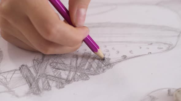 Closeup of Woman's Hands Making Sketch with Pencil