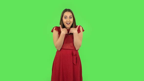 Tender Girl in Red Dress Is Pointing Herself, Say Who Me No Thanks i Do Not Need. Green Screen
