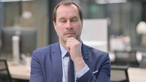 Portrait of Pensive Businessman Thinking