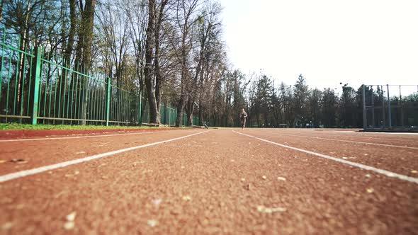 Athlete Woman Starting Running on Running Track