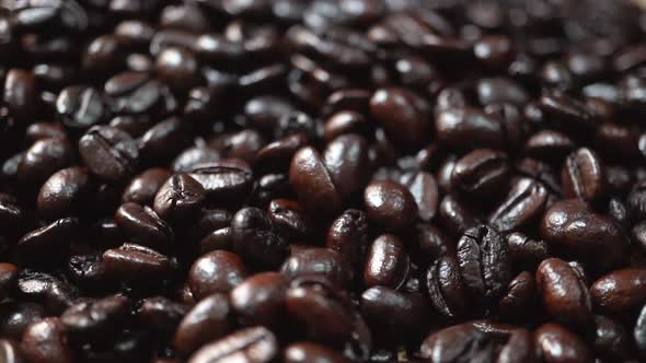 Rotation Shot of Heap of Dark Color of Raw Coffee Beans Texture Background