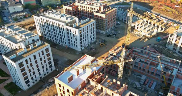 Panoramic View with Highrise Crane Under Construction Against Buildings
