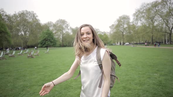 Rear view of a woman walking in a park in London, UK