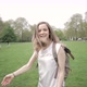 Rear view of a woman walking in a park in London, UK - VideoHive Item for Sale