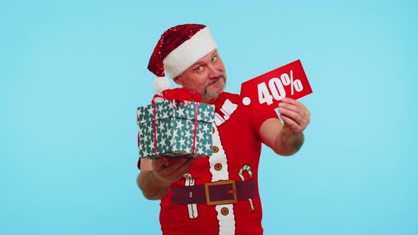 Man in Red Christmas Tshirt Showing Gift Box and 40 Percent Discount Inscriptions Banner Text Note