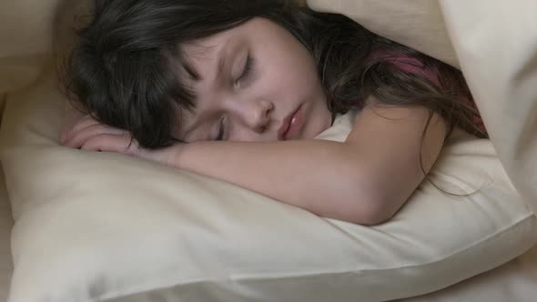 Child sleep on the pillow.