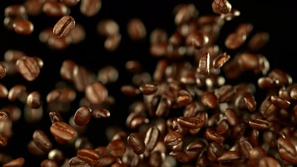 Super Slow Motion Shot of Exploding Premium Coffee Beans Towards the Camera at 1000Fps