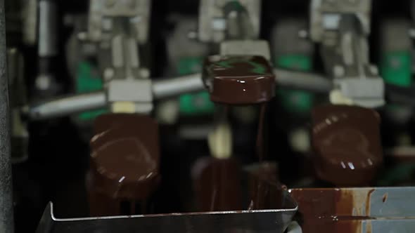 Ice-cream on a Stick Is Covered with Chocolate Icing. Chocolate Ice Cream Popsicle in Manufacturing