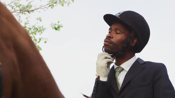 African American man riding his Dressage horse