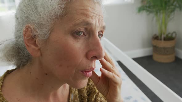 Animation of caucasian senior woman feeling bad, having headache