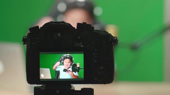 Camera Display Of Boy Playing Video Game With Phone Then Celebrating On Green Screen