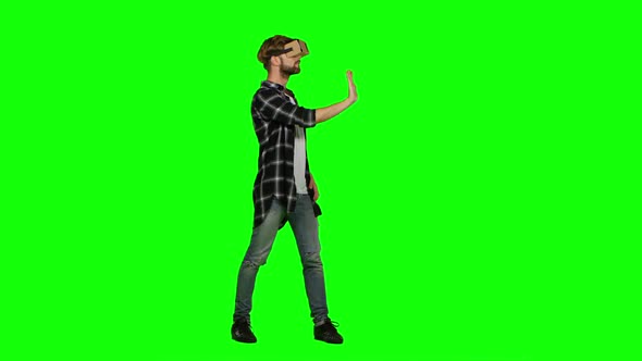 Man in Virtual Reality Glasses. Green Screen