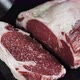 Raw Marbled Ribeye Beef Steak Sprinkled with Seasoning on Black Table Top - VideoHive Item for Sale