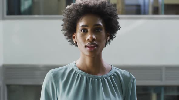 Video of happy african american businesswoman looking at camera