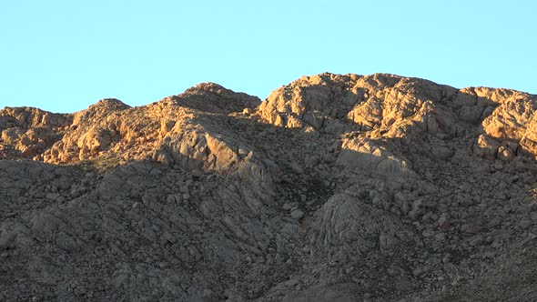 The First Lights of Morning on Mountains