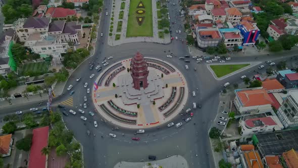 Independence Monument (Vimean Ekareach)  With Vehicles Driving At Intersection Of Norodom Sihanouk B