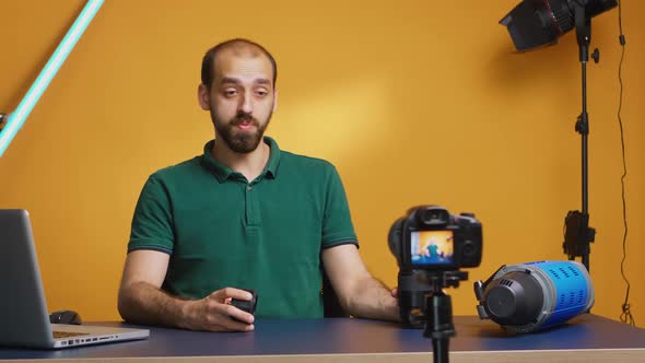 Photographer Testing Camera Lenses