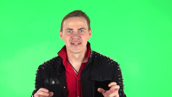 Guy Looking at Camera with Anticipation, Then Very Upset. Green Screen