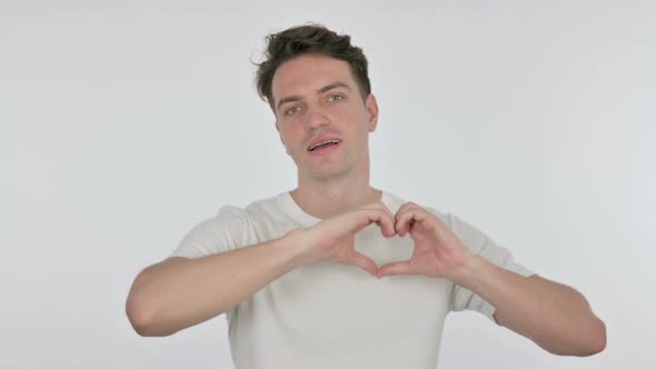 Handmade Heart By Young Man on White Background