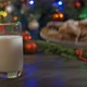 Woman Puts Gingerbread Cookies on a Wooden Table with Milk - VideoHive Item for Sale