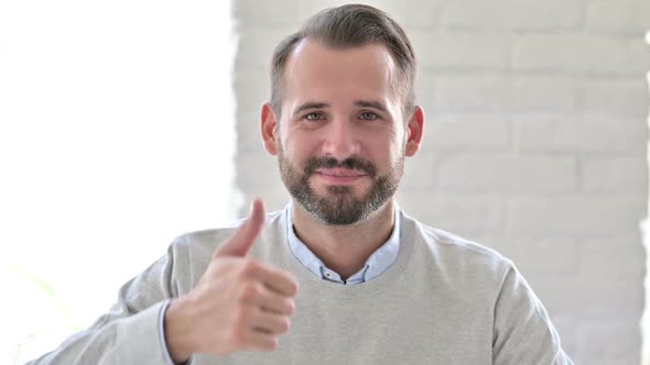 Portrait of Positive Young Architect Doing Thumbs Up