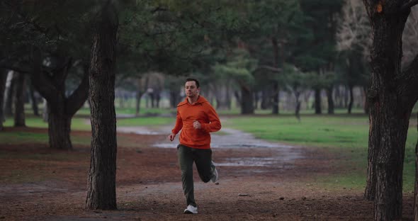 A Man Jogging Running in a Park Slow Motion