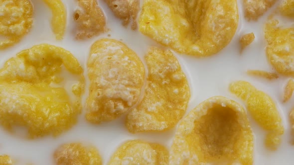 Cornflakes cereal and milk in a clay bowl. Morning breakfast.