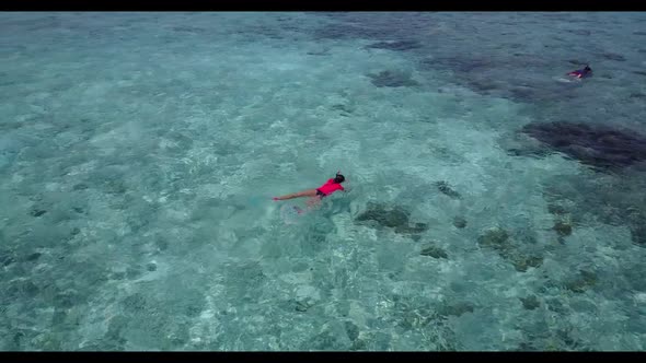 Aerial drone view abstract of relaxing coastline beach break by aqua blue sea and bright sandy backg