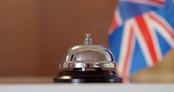 Cropped Shot of Guest Ringing Hotel Reception Service Bell to Attract Attention