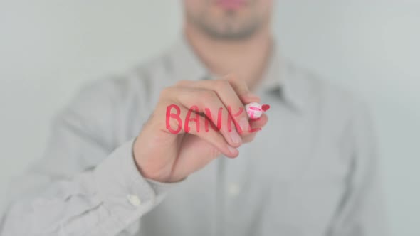 Banker Writing on Screen with Hand