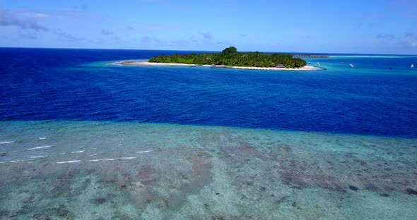 Beautiful overhead tourism shot of a sunshine white sandy paradise beach and blue ocean background i