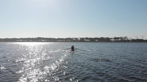 Female rowers training on a river