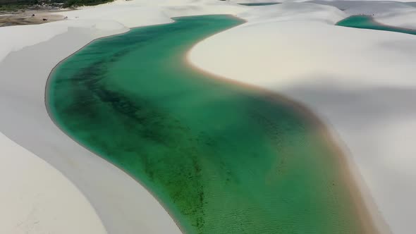 Sand dunes mountains and rain water lagoons at northeast brazilian paradise.