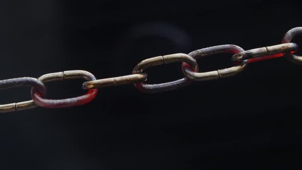 Weakest Link - Concept - Chain slowly heats up and starts to sparkle, chain collapses at the end